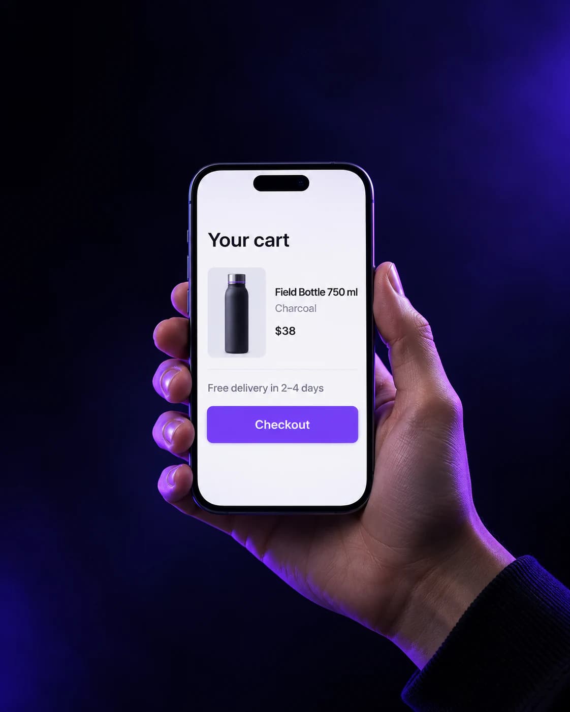 Hand holding a phone showing an illustrative cart with one Field Bottle 750 ml in charcoal at $38, free delivery in 2–4 days, and a Checkout button